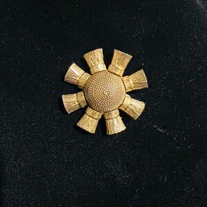 Vintage Etruscan Revival textured sun brooch in gold tone